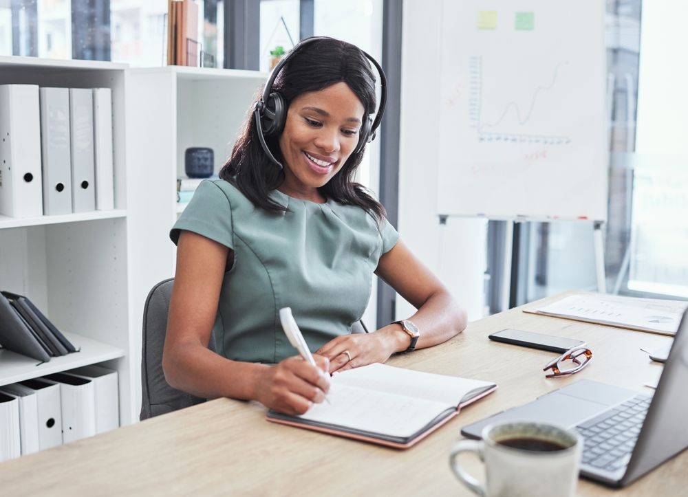 consultant writing at desk