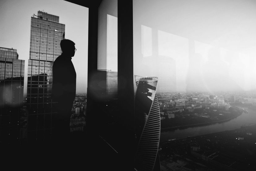 man staring out window img