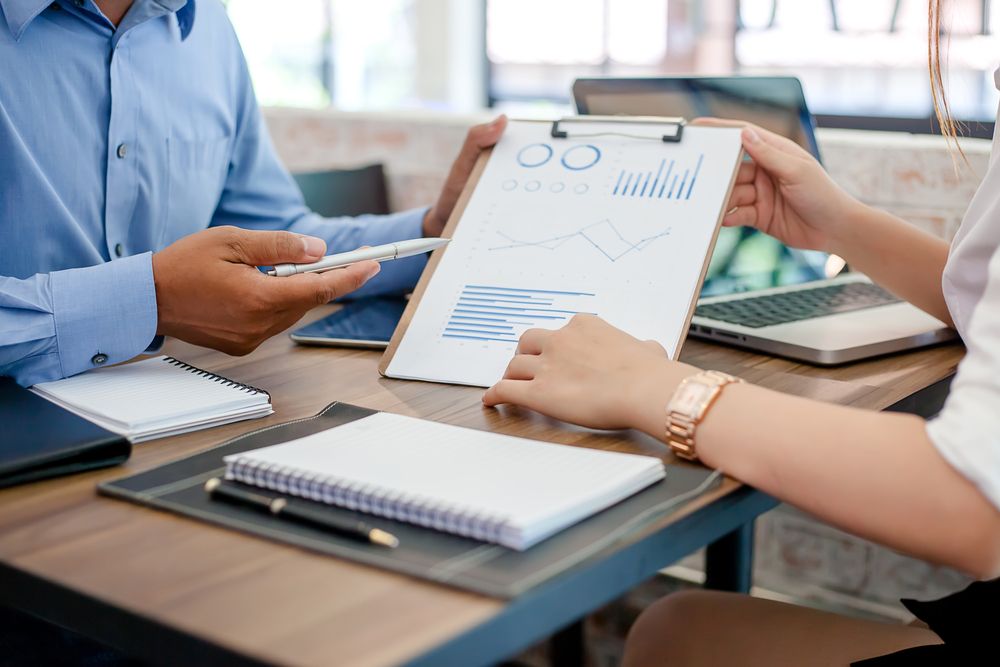 coworkers looking at paperwork